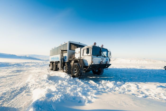Into the Glacier monster trucked parked in Langjokull's snow.