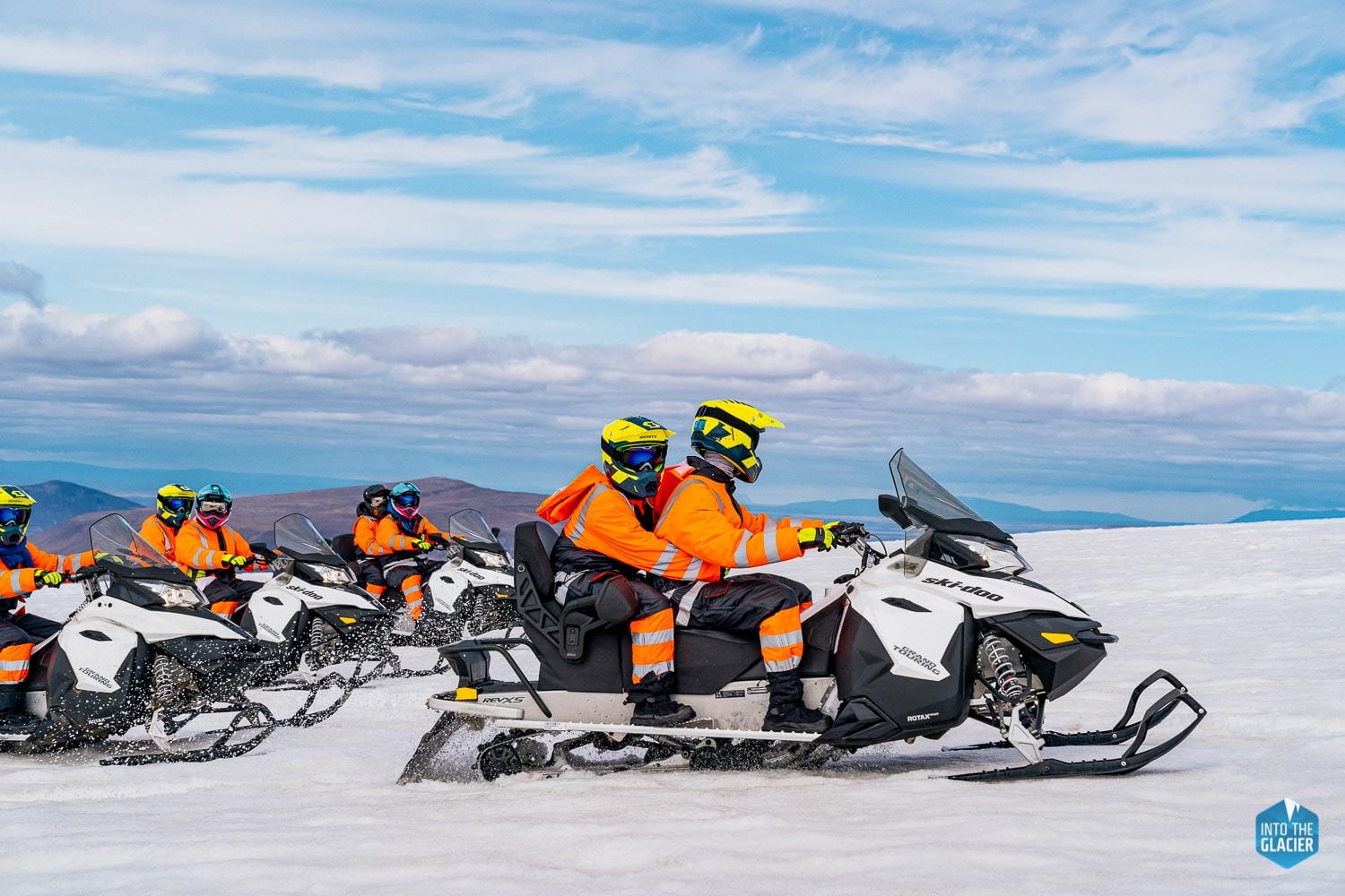 People snowmobiling on Langjokull glacier