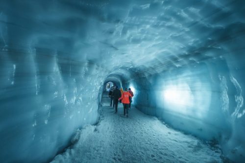 Small group tour walking inside langjokull glacier ice tunnel