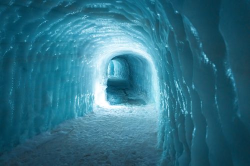 Langjokull glacier ice tunnel with blue reflecting light