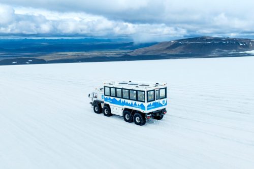 Monster truck driving across Langjokull glacier in Iceland.